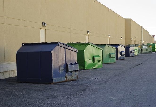 metal dump boxes positioned for construction cleanup in Highland City